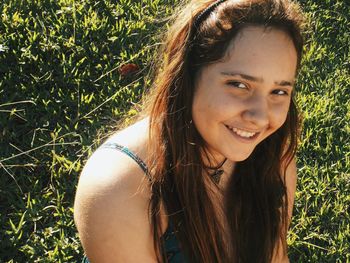 Portrait of smiling young woman on field