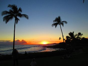 Silhouette of people on beach