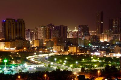 High angle view of illuminated buildings in city at night