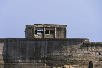 Low angle view of old building against clear sky