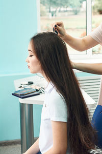 High school girls students comb their hair. anime style