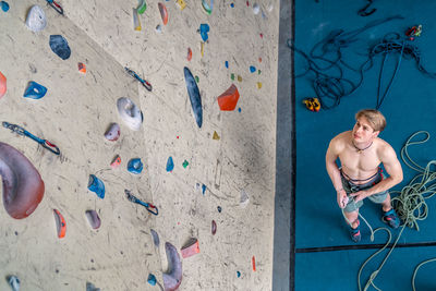 High angle view of woman standing on wall