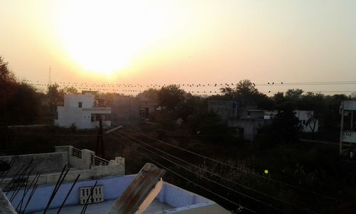 Panoramic view of city against clear sky during sunset