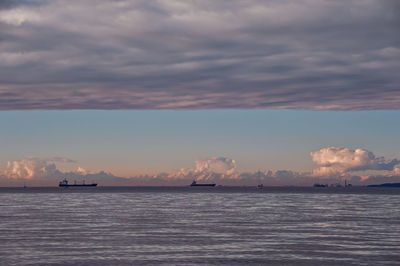 Scenic view of sea against storm clouds