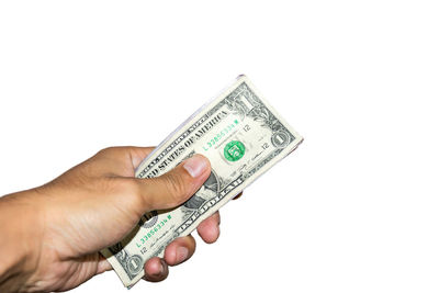 Midsection of person holding paper against white background