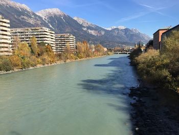 River amidst buildings against sky