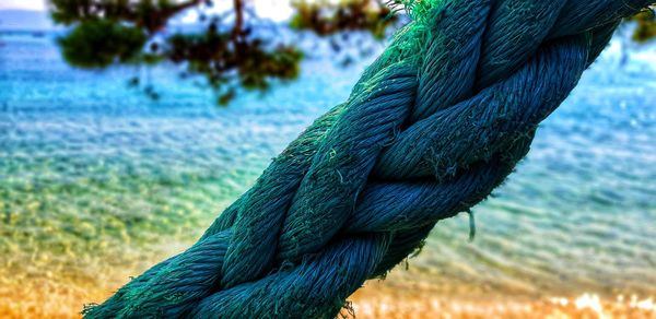 Close-up of rope against blue sky