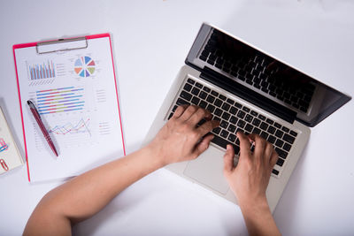 Midsection of person using mobile phone