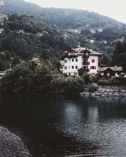 River amidst buildings and mountains