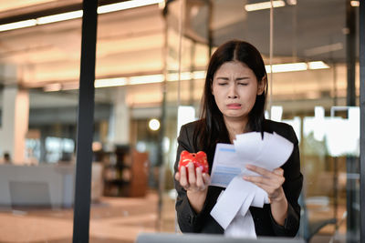 Businesswoman wearing blazer working in office