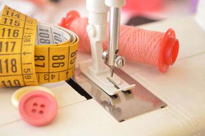 High angle view of tape measure with sewing items