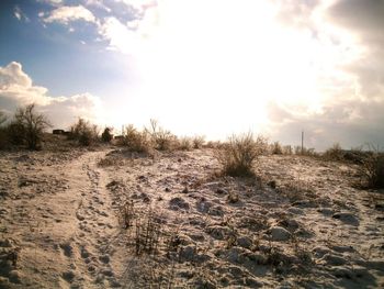 View of sand dunes against sky