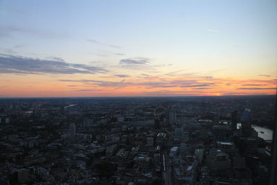 High angle view of buildings against sky during sunset