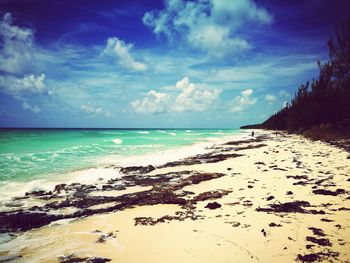 Scenic view of sea against cloudy sky