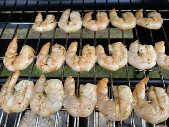 High angle view of meat on barbecue grill