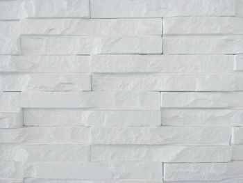 Low angle view of white wall