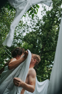 Rear view of couple on tree