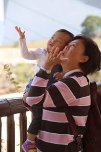 Mother with baby looking up