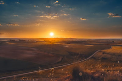 Scenic view of landscape against sky during sunset