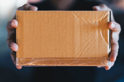 Close-up of hand holding ice cream