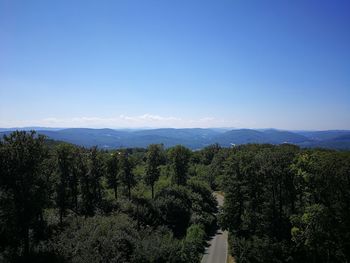 Scenic view of mountains against clear blue sky