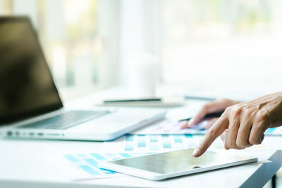 Man using laptop on table
