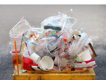 Close-up of garbage in jar on table