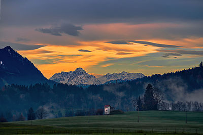 Scenic view of field against sky during sunset