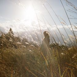 Silhouette of woman against sky