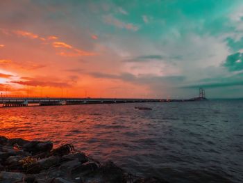 Scenic view of sea against sky during sunset