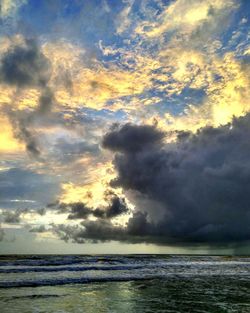 Scenic view of sea against sky at sunset