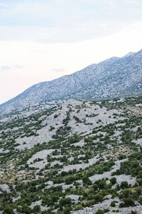 Scenic view of snow covered mountain against sky