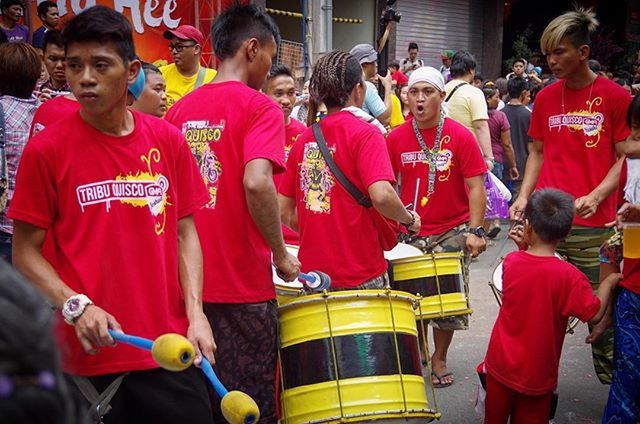 lifestyles, large group of people, men, leisure activity, togetherness, casual clothing, person, love, standing, bonding, crowd, red, boys, friendship, happiness, fun, traditional clothing, childhood