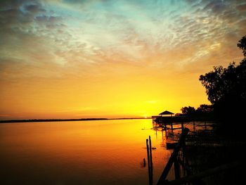 Scenic view of sea against orange sky