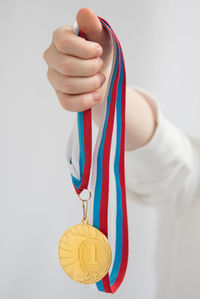 Midsection of man holding hands over white background