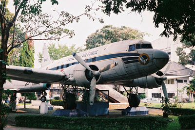 Airplane on runway against sky