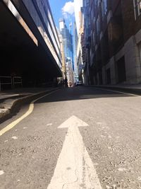 Surface level of street amidst buildings against sky