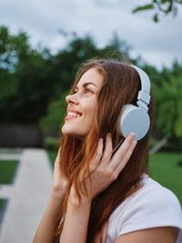 Portrait of young woman using mobile phone