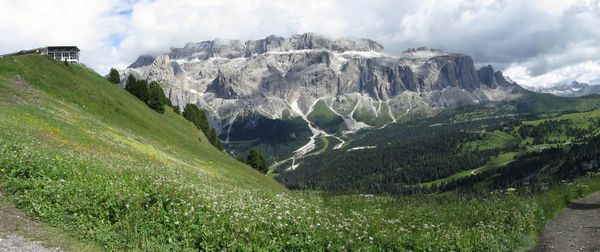 Scenic view of mountains against cloudy sky