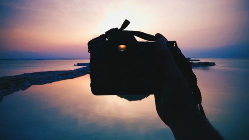 Scenic view of sea at sunset