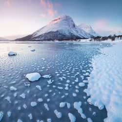 Scenic view of frozen lake against sky