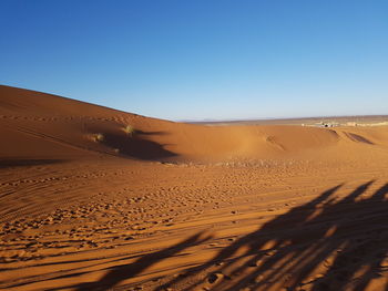 Scenic view of desert against clear sky