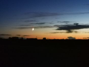 Scenic view of silhouette landscape against sky during sunset