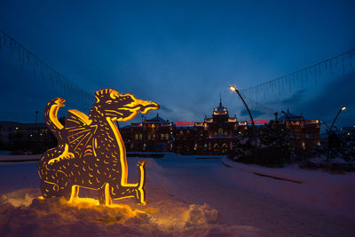 Scenery of a luminous dragon in kazan against the backdrop of the railway station