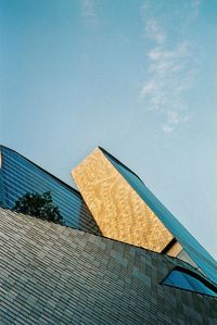 Low angle view of building against blue sky