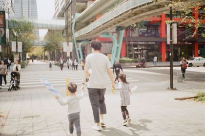 People walking on street in city