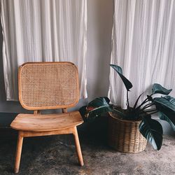 Empty chairs and table against wall at home