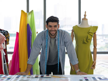 Young man standing at home