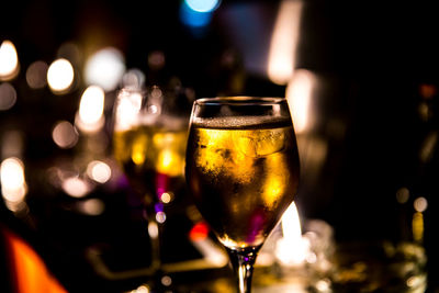 Close-up of wine in glass at bar