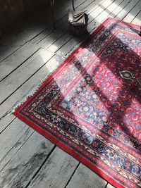 High angle view of carpet on wooden floor